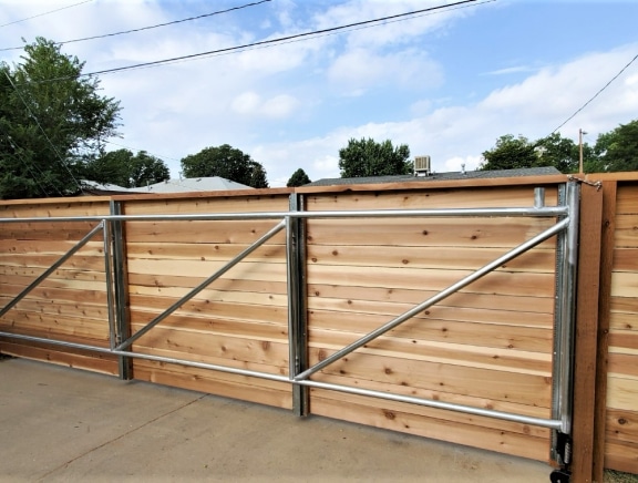 wooden-wall-security-fence-with-seamless-gate-installation-and-access-control-system-in-denver-co